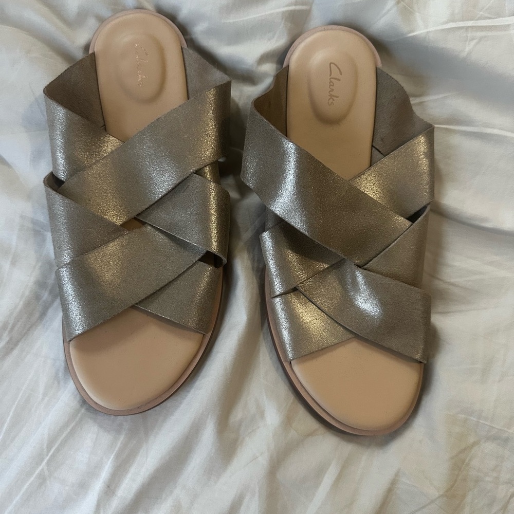 Clarks Sandals. No wear on them. Gold leather.
